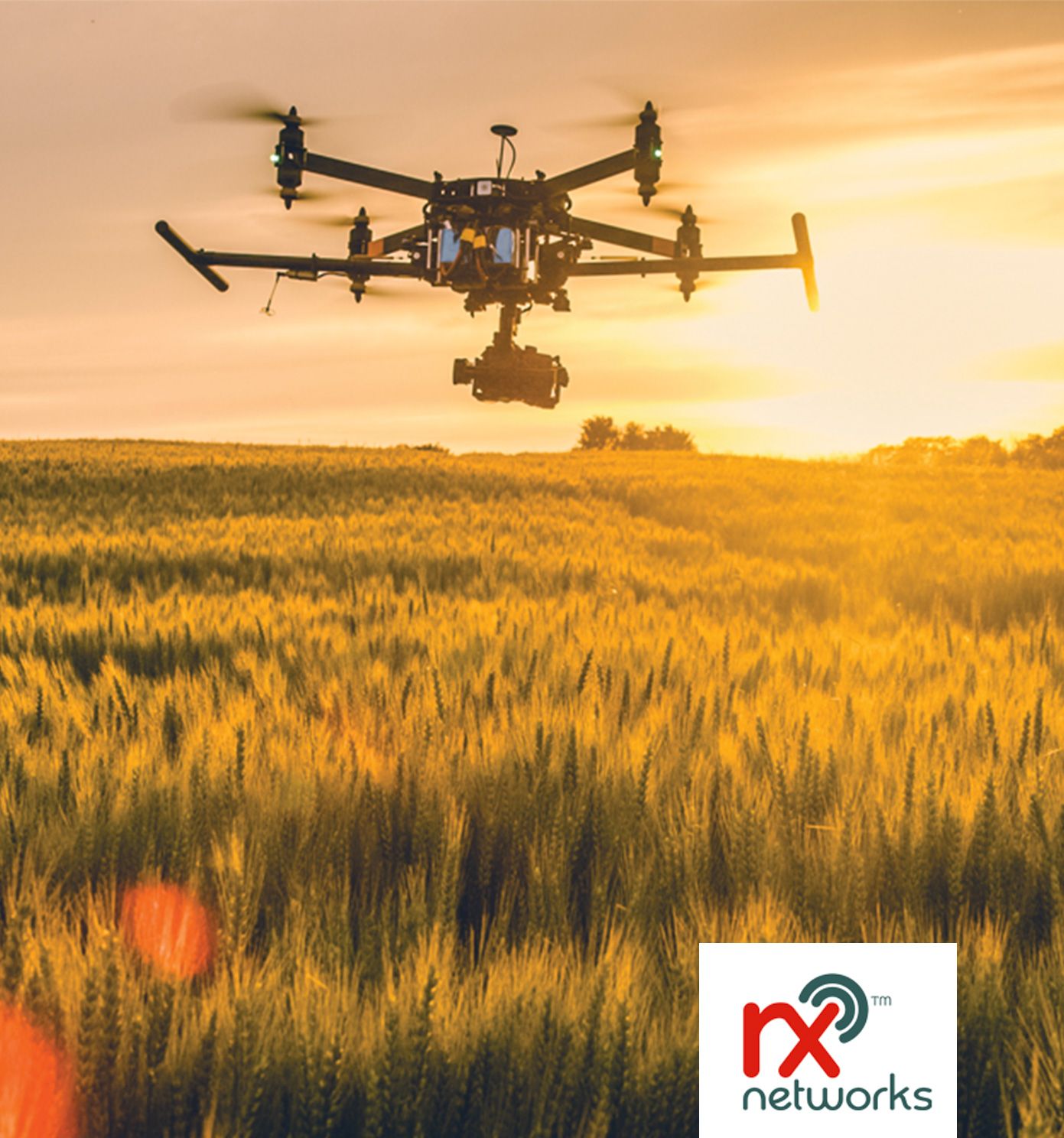 Drone over field with rx logo